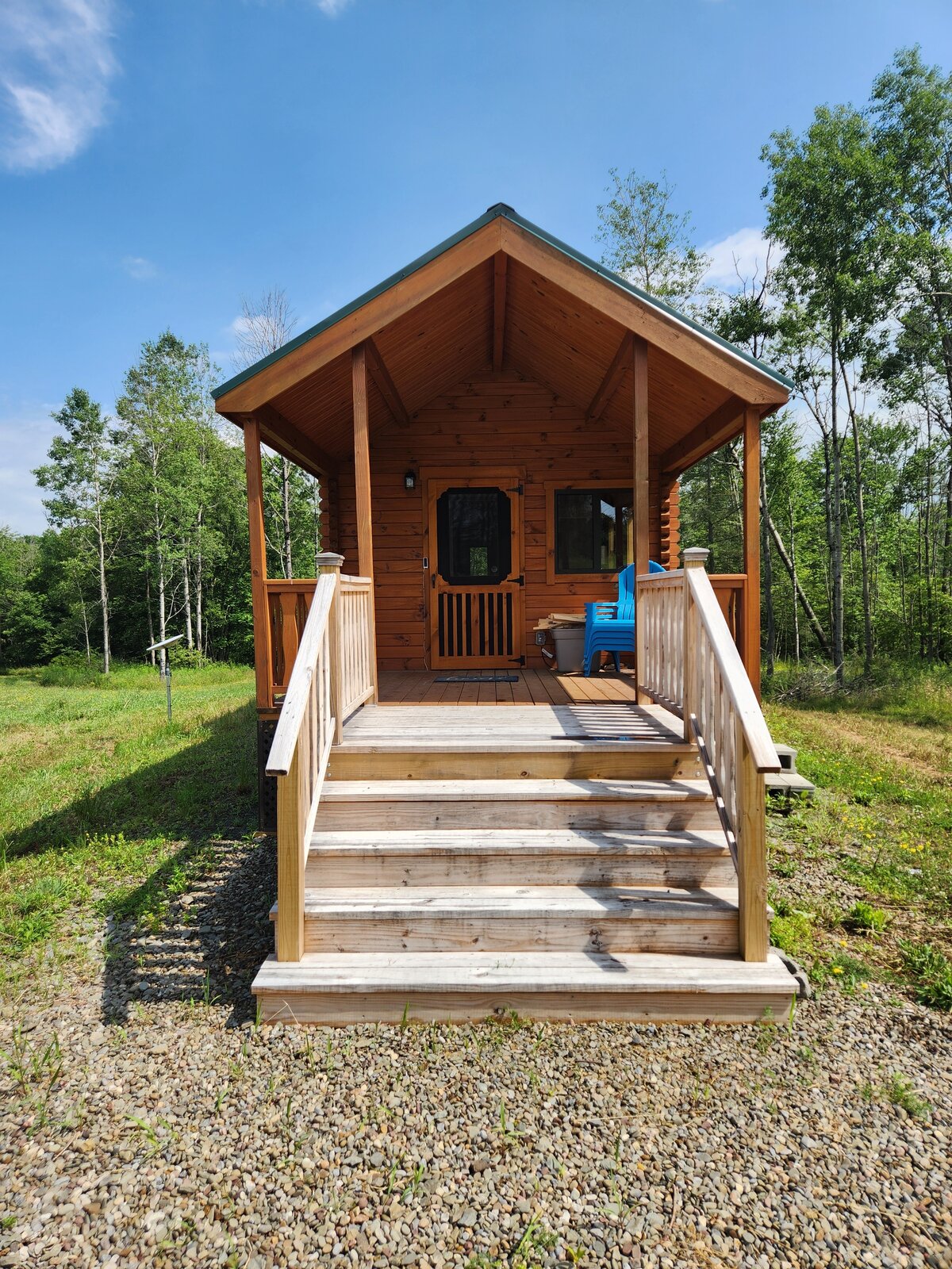 The cabin's front porch on a sunny summer day