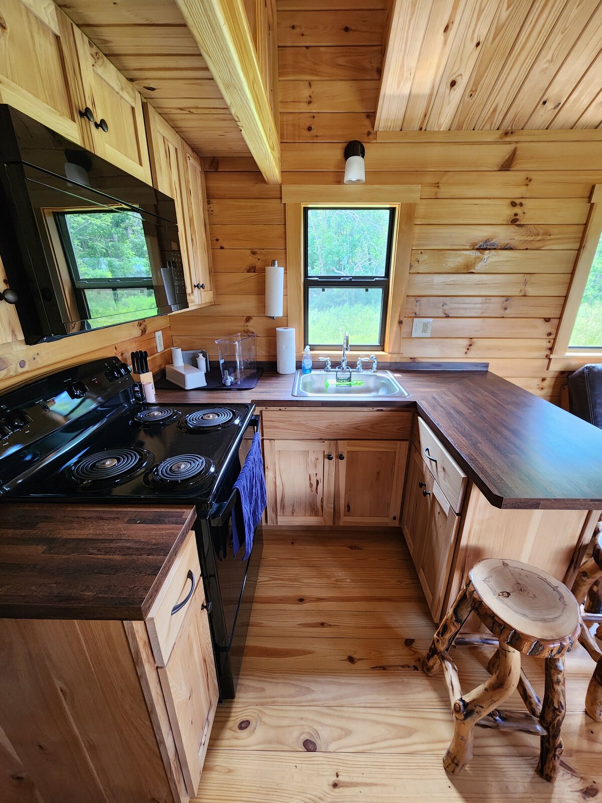 The kitchen with full-size range and butcher-block counters